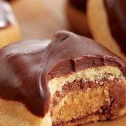 Recipe for Peanut Butter Secrets - A peanut Butter cookie stuffed with a Peanut Butter Cup, and topped with a peanut butter chocolate glaze. I LOVE them!