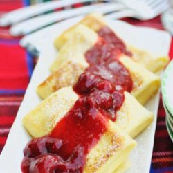 Recipe for Cheese Blintzes with Mixed Berry Sauce - The two thin layers of cake surrounding a layer of sweet cheese filling are not too sweet, not too heavy, and easy to prepare in advance.