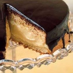 Recipe for Boston Cream Pie - This American classic, first made by a Boston chef in the 1850s, isn't actually a pie at all, it's a cake: two sponge layers with custard-cream filling and a shiny chocolate glaze.