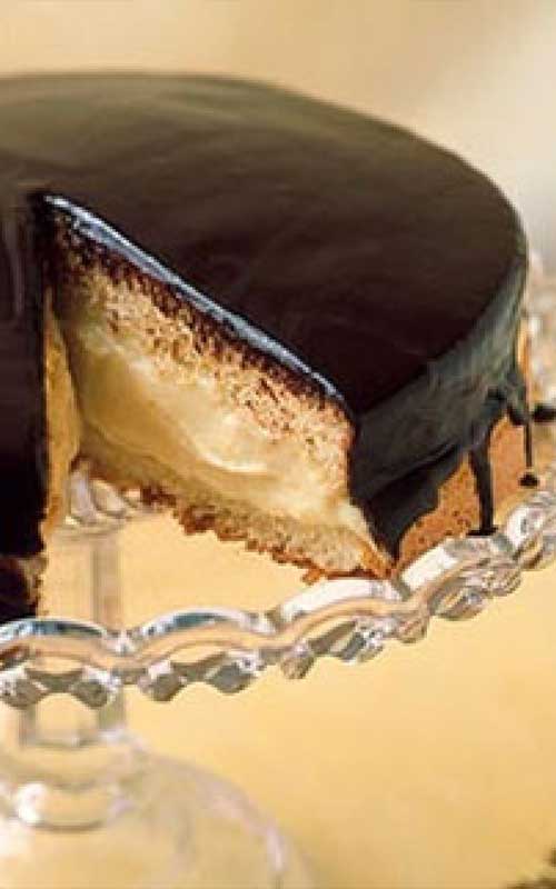Recipe for Boston Cream Pie - This American classic, first made by a Boston chef in the 1850s, isn't actually a pie at all, it's a cake: two sponge layers with custard-cream filling and a shiny chocolate glaze.