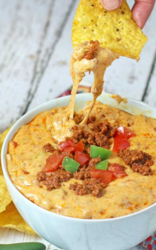 This Crazy Chorizo Queso Dip is a DELICIOUS sausage and creamy Cheddar and Jack, mixed with zesty spiced chilies that will get your guests up and out of their seats!