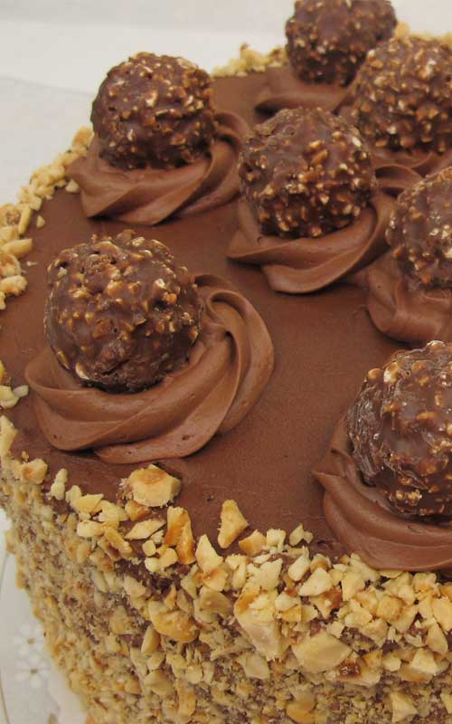 Recipe for 5-Layer Ferrero Rocher Nutella Dream Cake - This sinful cake surpassed my vision! The cake was light, moist, and delicious (all must-haves!) and the “Nutella Cloud Frosting” certainly tasted like a dream! (Even as a non-frosting eater, I found myself licking my fork!)
