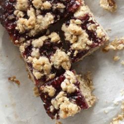 Recipe for Raspberry Oat Crumble Bars - These bars bake up into three layers of shortbread goodness, sweet raspberry, and buttery crumble. They taste like brown sugar and old-fashioned oats, with a healthy smear of jam oozing out the middle.
