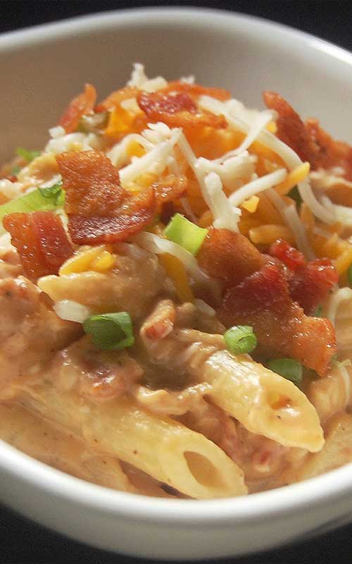 Recipe for BBQ Chicken and Bacon Pasta - It’s smokey and creamy and cheesy. It’s pure comfort food, and something that this barbecue-loving family will be indulging in frequently.