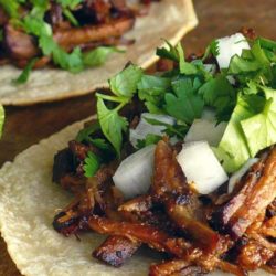 Recipe for Tacos De Barbacoa - Good barbacoa is succulent beef that is slow-simmered in a spicy broth flavored with tangy lime juice, smoky chipotle chiles and plenty of garlic until it’s practically falling apart.
