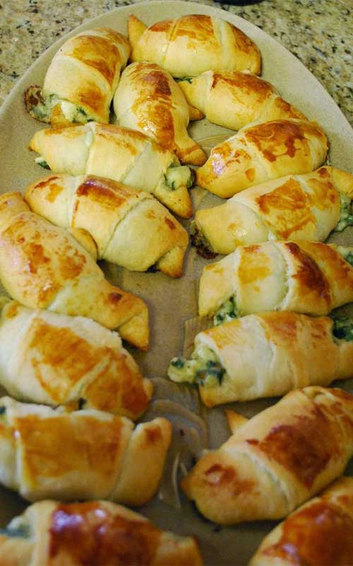 Recipe for Windy City Crescent Rolls - These are simple to make and super yummy. Served warm and gooey and stuffed with feta and spinach, it's hard to eat just one!