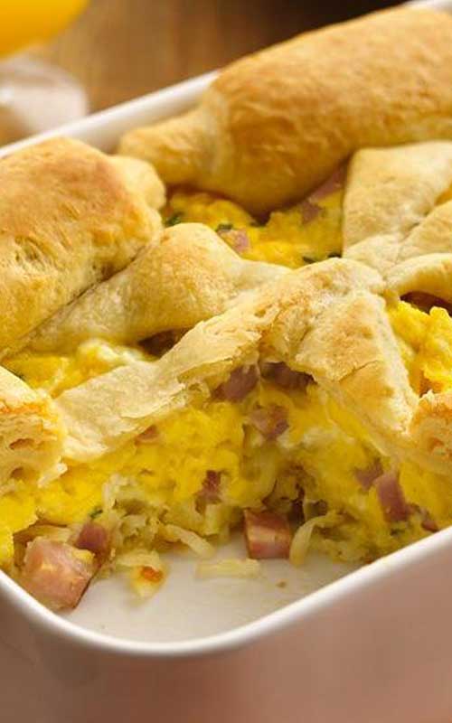 Recipe for Country Breakfast Pot Pie - Enjoy this cheesy pot pie made using refrigerated crescent dinner rolls, eggs and ham – a breakfast ready in less than an hour.