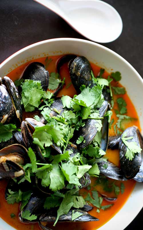 Recipe for Thai Curry Mussels - These Thai Mussels make a beautiful gourmet-style dinner, and they're easy to make too! If your mussels are already clean and ready to go, this dish can literally be on your table in just minutes.