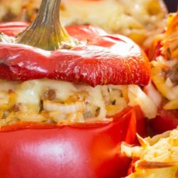 Recipe for Rice Stuffed Red Peppers - Here is a recipe for a meatless stuffed red pepper. Instead you have fresh mushrooms, onion, rice and two types of cheese.