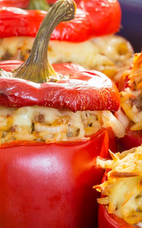 Recipe for Rice Stuffed Red Peppers - Here is a recipe for a meatless stuffed red pepper. Instead you have fresh mushrooms, onion, rice and two types of cheese.