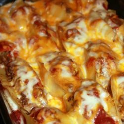 Recipe for Taco Stuffed Shells - Pasta shells get a south of the border makeover when filled with taco ingredients and your favorite salsa. It is so good you may want to double the recipe, so you can freeze some to enjoy later!