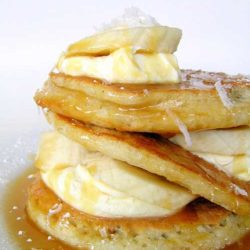 Recipe for Coconut Pancakes With Caramel Sauce - This is one of the most delicious stacks of pancakes I have ever eaten. And it’s super sweet. But that’s okay, because the tang from the creme fraiche balances everything out perfectly.