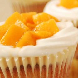 Recipe for Mango Cream Cheese Cupcakes - If you love cream cheese and mango together with a super light and moist, bakery-like cupcake...then this is for you!