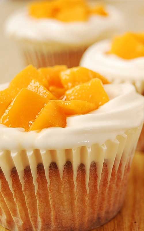 Recipe for Mango Cream Cheese Cupcakes - If you love cream cheese and mango together with a super light and moist, bakery-like cupcake...then this is for you!