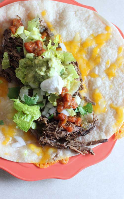 Recipe for Slow Cooker Mexican Shredded Beef - Oh my goodness this beef is good. I suspect it’s much much better than Chipotle...because WOW, so much flavor! And tender and easy because you just throw it in the slow cooker.