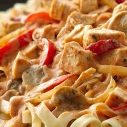 Recipe for Cajun Chicken Fettuccine - Colorful veggies and traditional Cajun seasonings combine with rotisserie chicken to quickly create this spicy chicken dinner.