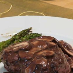 Recipe for Pepper Steak with Port Wine Mushroom Sauce - Slather pan-seared beef fillets with a homemade port-wine mushroom sauce for a easy but elegant entrée.