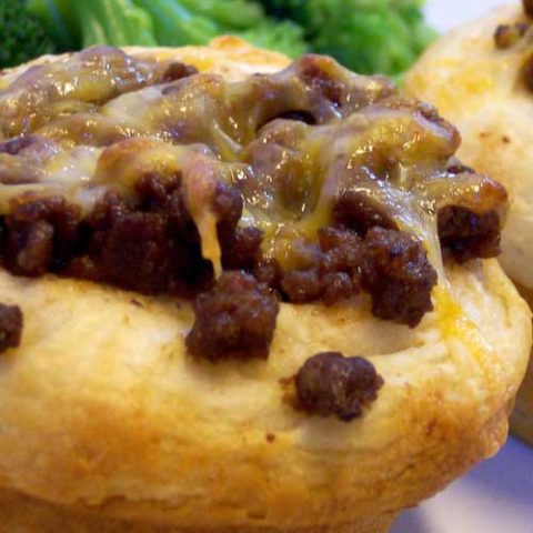 Recipe for BBQ Cups - Refrigerated biscuits become the edible bowls in this zesty, cheese-topped winner.