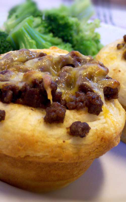 Recipe for BBQ Cups - Refrigerated biscuits become the edible bowls in this zesty, cheese-topped winner.