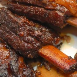 These flavorful braised short ribs perfectly illustrate how braised meat cooked on the bone can turn out succulent and tender enough to cut with a fork.