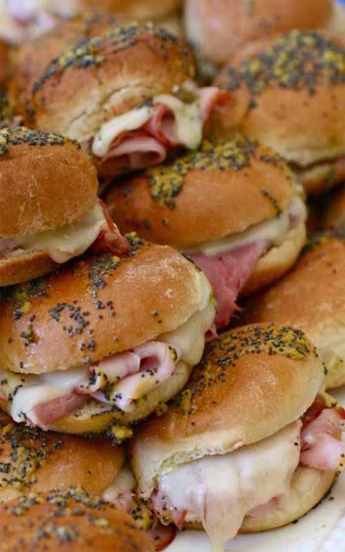 Recipe for Ham and Cheese Sliders - These sliders are completely addictive, thanks to the buttery and tangy sauce drizzled on top of them. Delish!