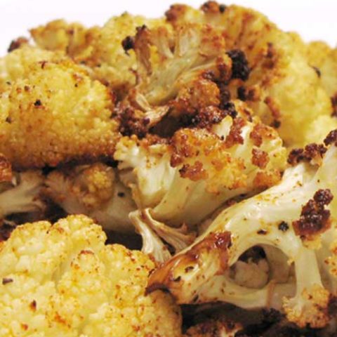 Recipe for Roasted Cauliflower - Blasting cauliflower florets in a hot oven concentrates their natural sweetness, turning them into something akin to vegetable candy.