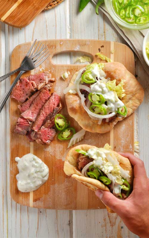 Recipe for Easy Steak Gyros with Homemade Pitas - As summer peaks around the corner, you're going to want this recipe in your arsenal for those sunny beach day picnics.