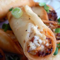 Recipe for Chicken and Bacon Mini Taquitos - These delectable appetizers take a little bit of work, but are so worth it. Served with a tasty avocado sauce, they'll disappear as soon as they come out of the pan!
