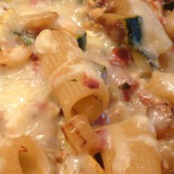 Recipe for Baked Ziti and Summer Vegetables - Add some pops of color to this simple baked ziti using summer veggies like tomatoes, squash, and zucchini.