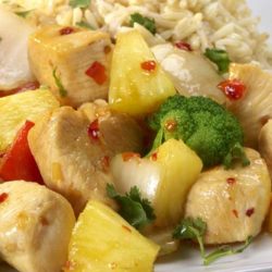 A deliciously sweet and savory dish featuring chicken, fresh pineapple and red bell peppers.