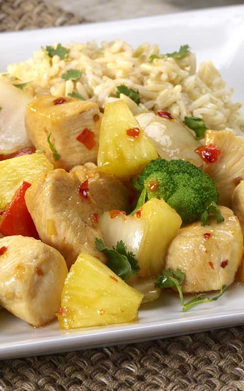 A deliciously sweet and savory dish featuring chicken, fresh pineapple and red bell peppers.