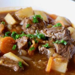Recipe for Healthier Irish Beef Stew - This hearty and healthier Irish beef stew may be better for you, but it does not sacrifice any flavor. Simmering for about 2 hours makes the meat and vegetables fork tender and delicious.