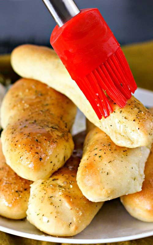 Recipe for Garlic Butter Breadsticks - These irresistible and simple Garlic Butter Breadsticks are so light, airy, and crispy, that you will be BEGGED to make them over and over again!