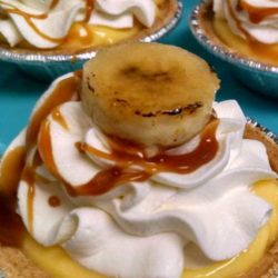 Recipe for Individual Banana Cream Pies - This easy and yummy recipe for Individual Banana Cream Pies is the perfect ending to any holiday meal. Sweet banana, rich pudding, and fluffy whipped cream packed into a mini flakey pie crust! Who could ask for anything more?! These would also be great for potlucks, partys, or if you are like me...anytime snacking.