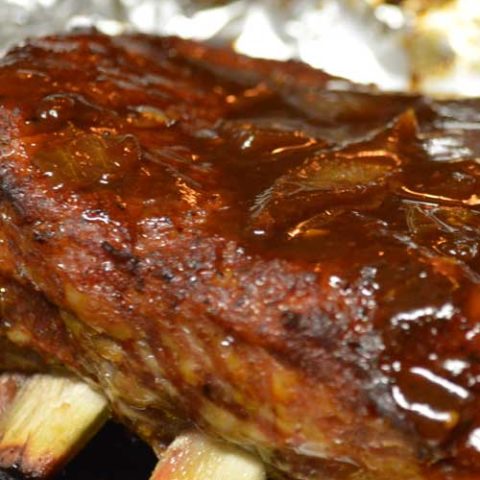 Recipe for Sweet & Sticky BBQ Ribs - It's really easy to get the low and slow smokehouse flavors of these Sweet & Sticky BBQ Ribs at home. With a spice rub, some time, and BBQ sauce, you will be devouring the best ribs in town.