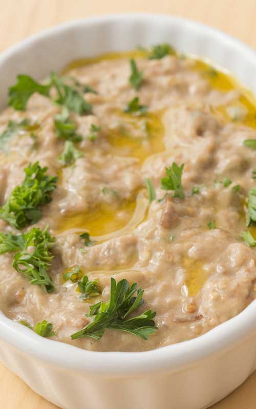 This Roasted Eggplant Dip is the easiest, tastiest, and most healthy appetizer you can make for any party! Naturally gluten free and low carb, you don't have to feel bad if you can't stop eating it.