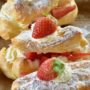Eclairs are one of my favorites. These Strawberry Cheesecake Eclairs take that favorite and make it even more sinfully indulgent and decadent. You will not miss the chocolate with this version!