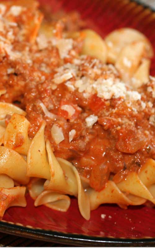 A thick, rich meat sauce with great depth of flavor. Made in under an hour, this is a Pasta Bolognese recipe that you will make over and over again!