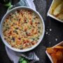 This decadent Baked 3 Cheese Spinach and Artichoke Dip recipe is loaded with three cheeses and baked to bubbly perfection. It always leaves my guests begging for more after scraping the bowl clean.