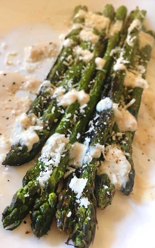 Looking to change up your boring Caesar salad? This Caesar Grilled Asparagus Salad replaces lettuce with asparagus, and could not be any more delicious!