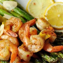 This Lemon and Garlic Shrimp Over Asparagus is an easy, quick, and healthy entree that is cooked in one pan and can be on your table in under 25 minutes.